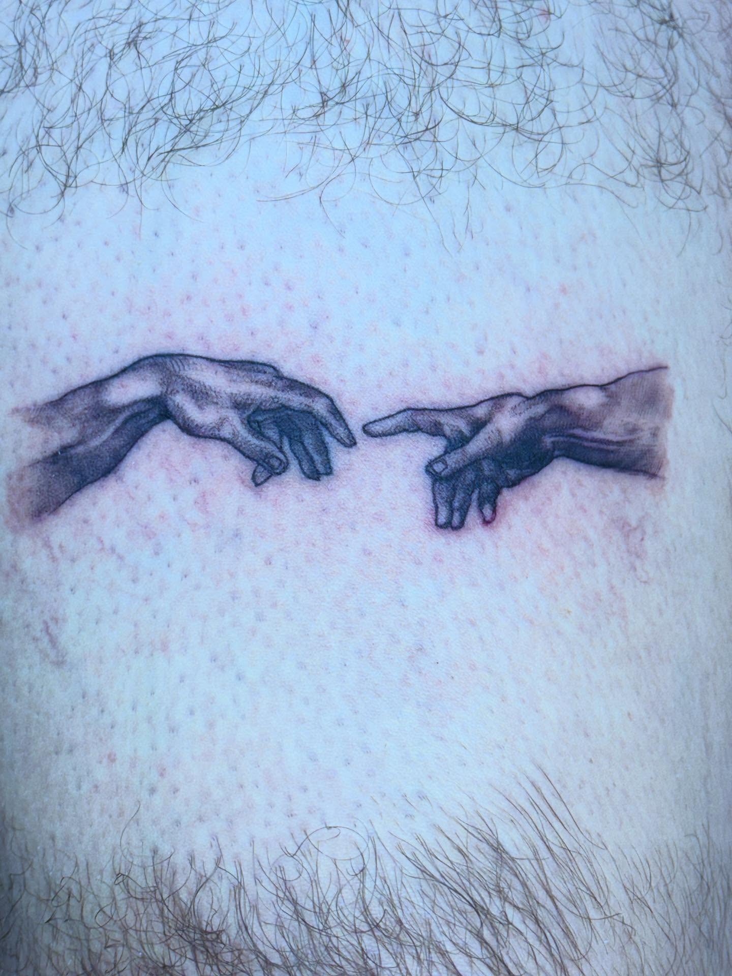 Hands reaching black and grey tattoo on the chest by Aaron Hassler, Nashville, Tennessee
