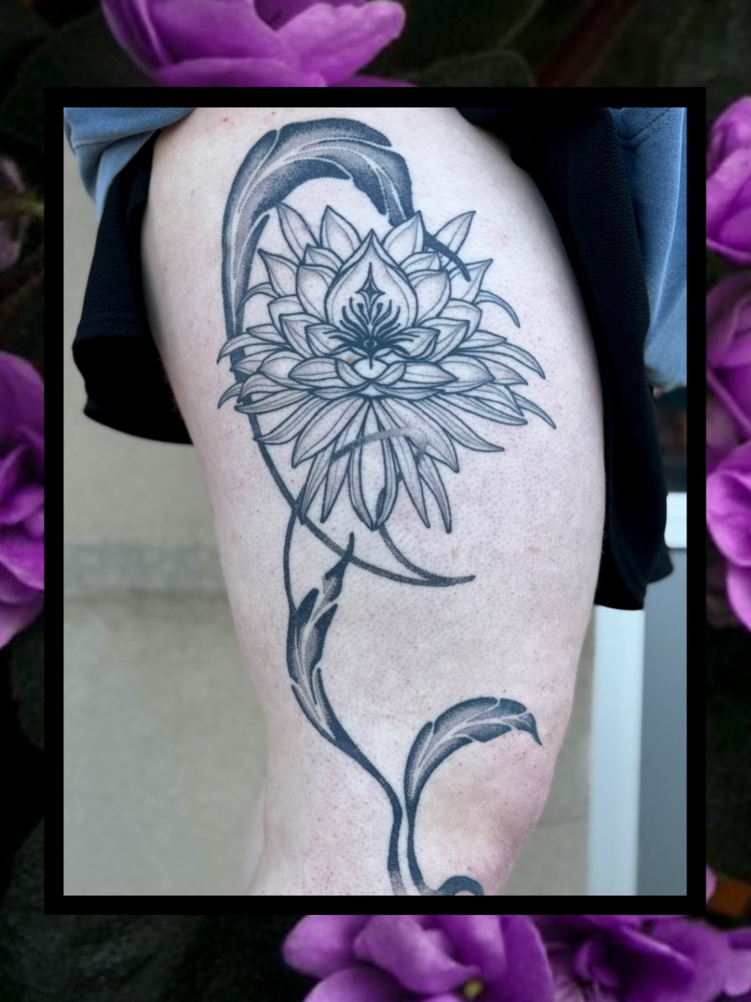 Lotus flower black and grey tattoo on the thigh by Sydney
