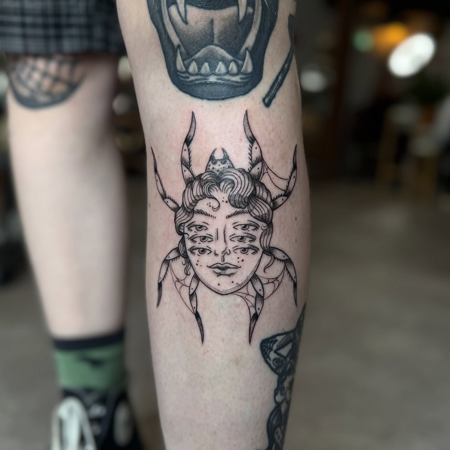 Woman with horns geometric tattoo on the forearm by Molly Jones