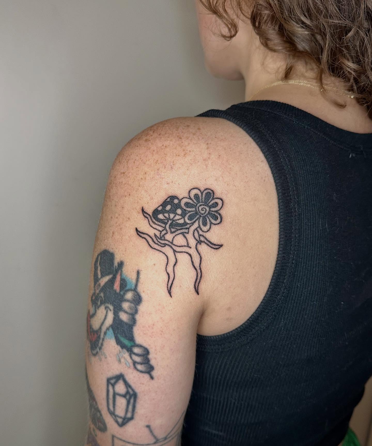 Mushroom and flower dotwork tattoo on the shoulder by Jadelin, San Francisco, California