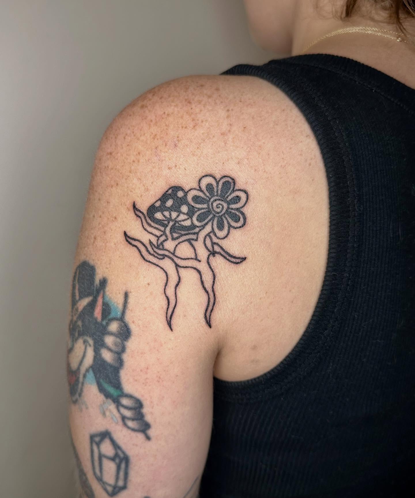 Flower black and grey tattoo on the shoulder by Jadelin, San Francisco, California