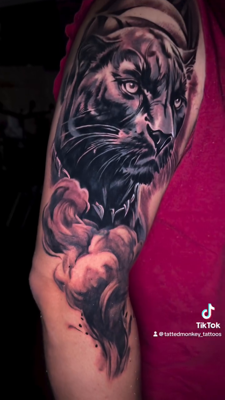 Panther head with clouds realism tattoo by Davone Joyner, Richmond, Virginia