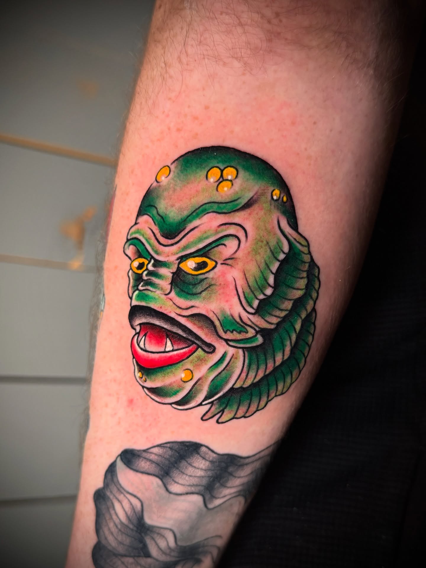 Alien creature American traditional tattoo on the forearm by Tattoo & Body Artist, Gastonia, North Carolina