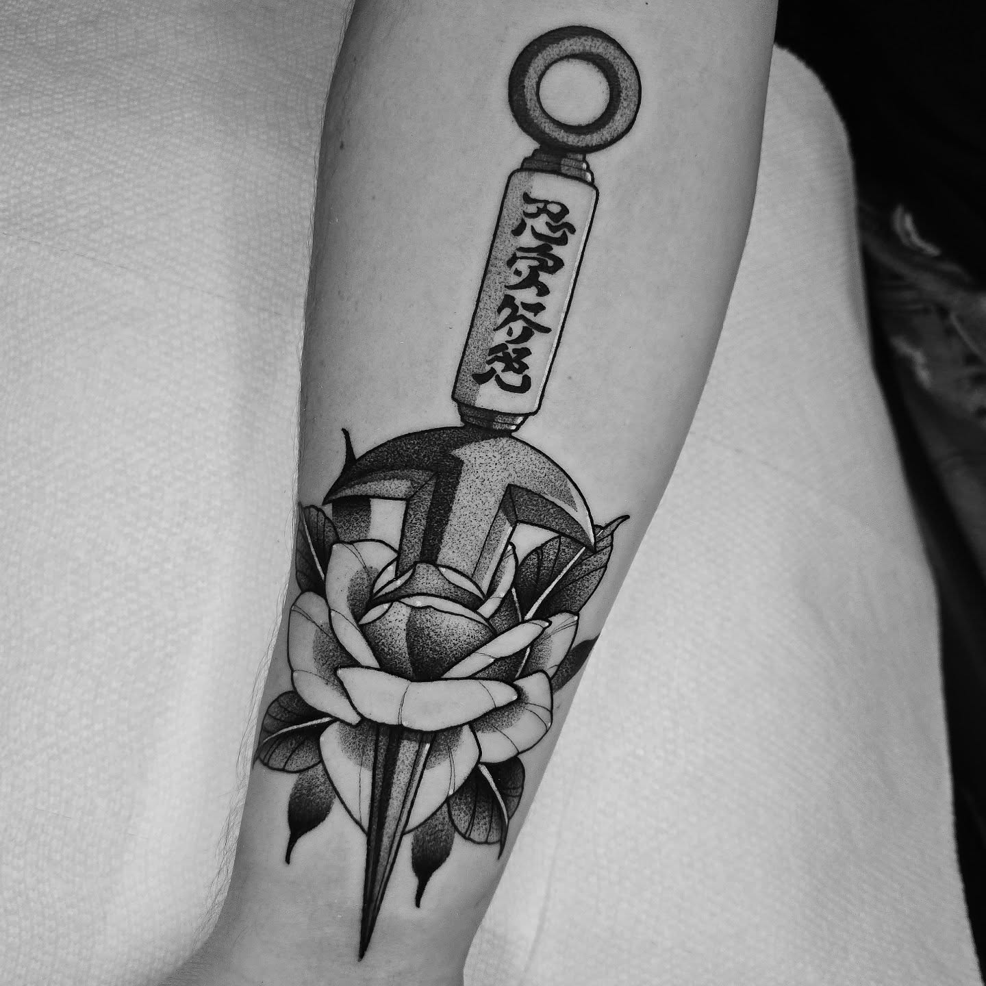 Katana and rose dotwork tattoo on the forearm by Justin Eldridge