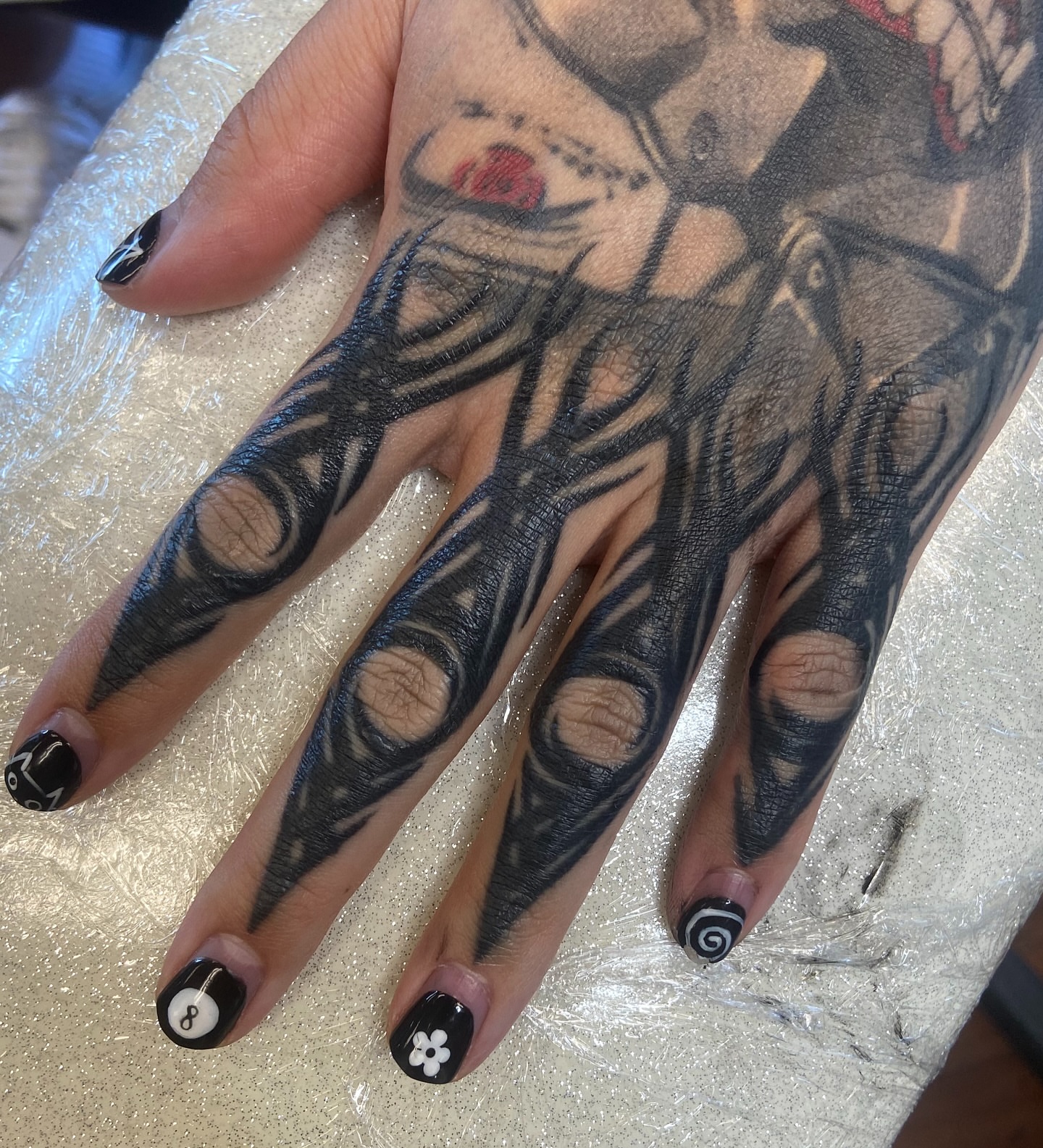 Abstract design black and grey tattoo on the hand by Nathan