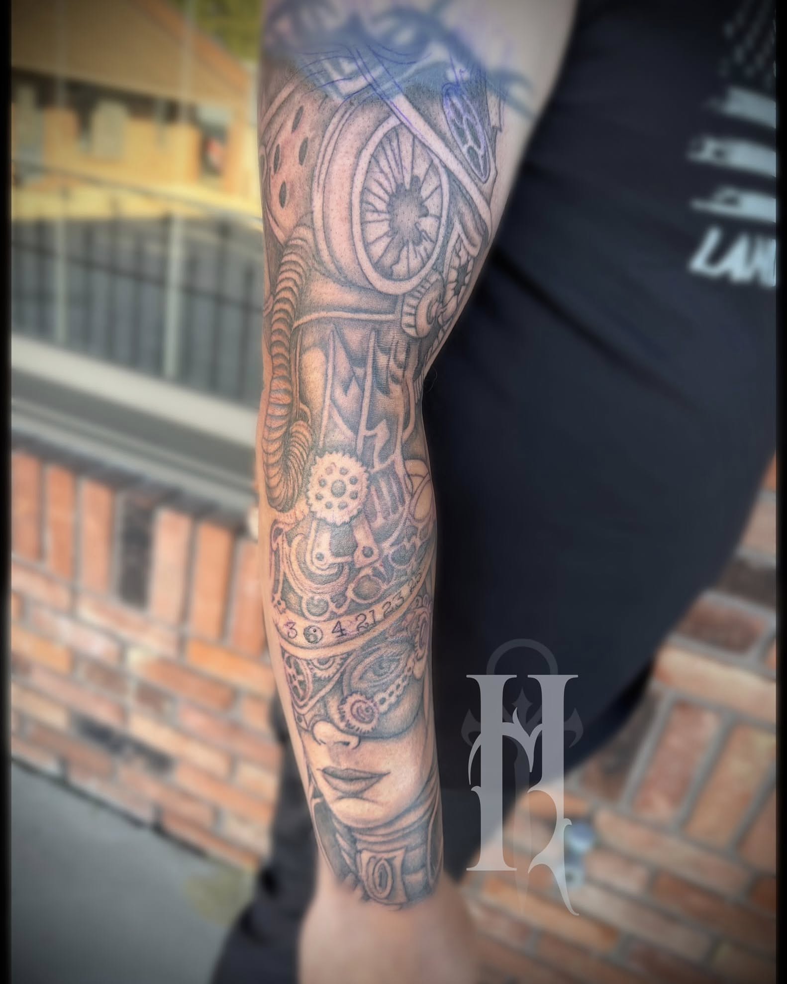 Mechanical gears and woman's face geometric tattoo on the forearm by Tattoos by Dan Hatcher Carr, Parma, Ohio