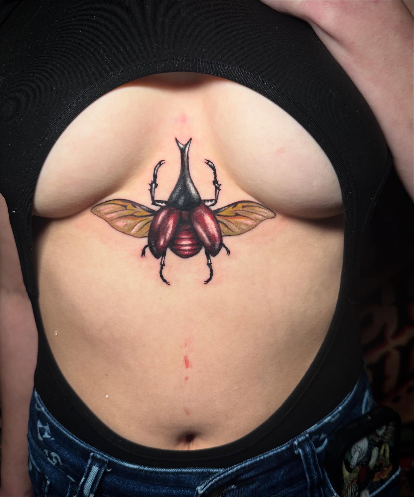 Beetle realism tattoo on the torso by Alexis Monkiewicz