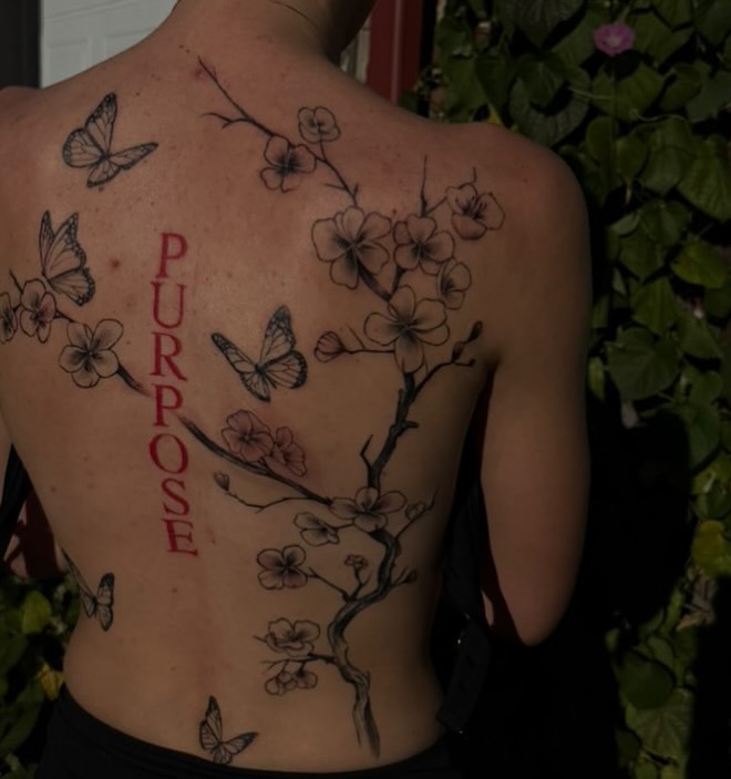 Cherry blossoms and butterflies fine line tattoo on the back by Trinity