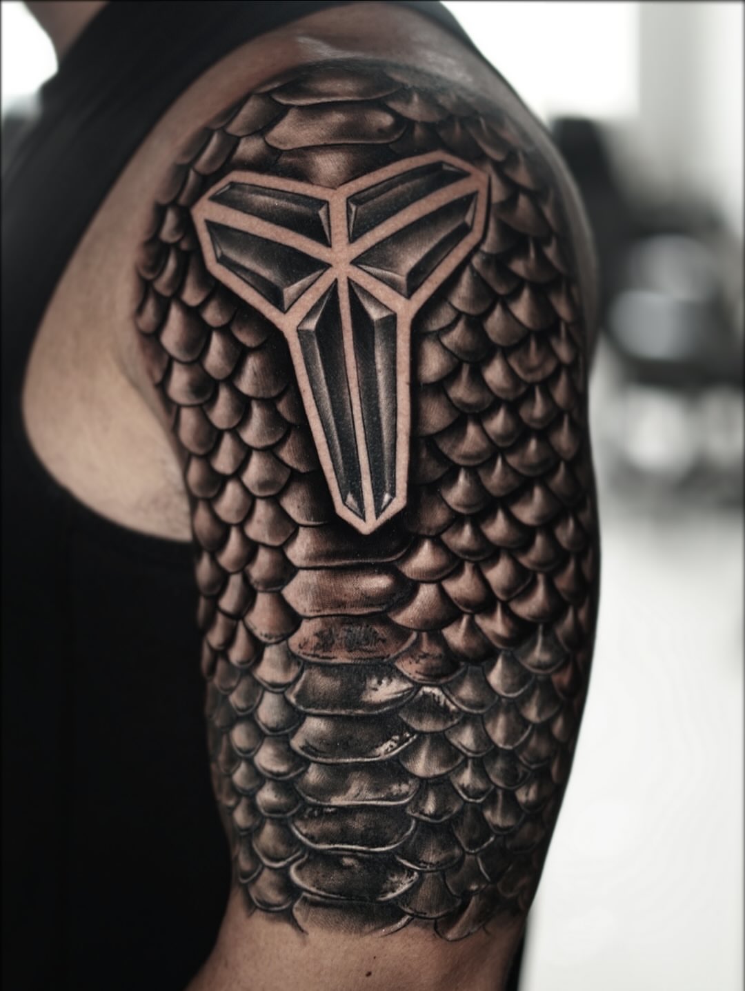 Dragon scale armor geometric tattoo on the shoulder by Angel Perez