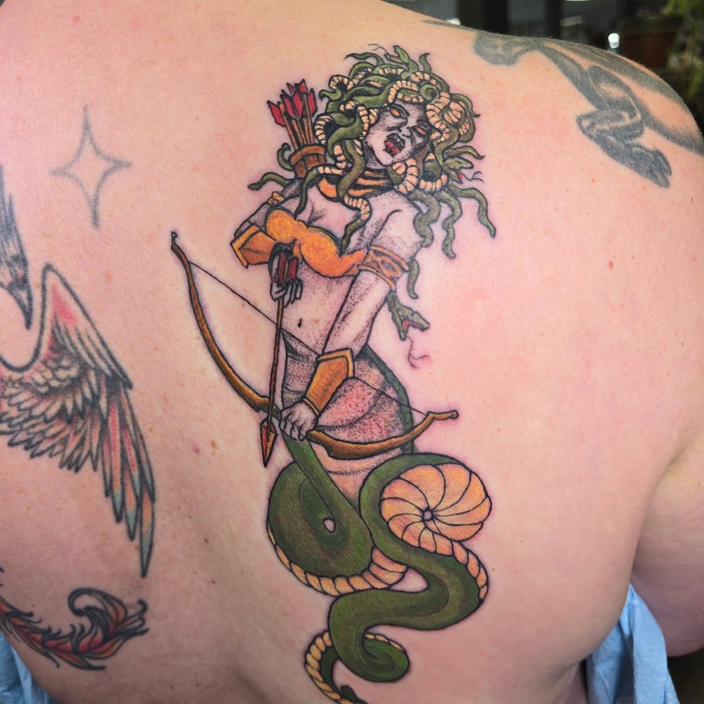 Medusa American traditional tattoo on the shoulder by Karen Cain