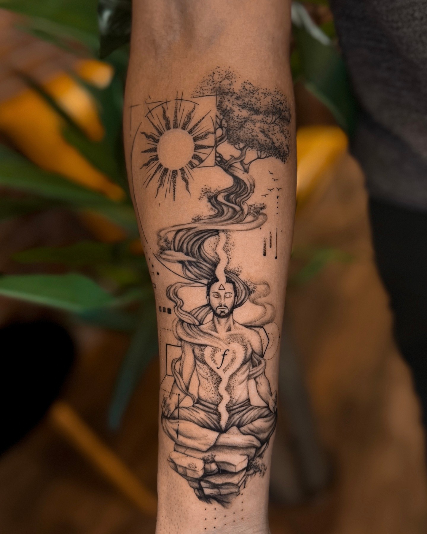 Meditation figure dotwork tattoo on the forearm by Christian Guerrero