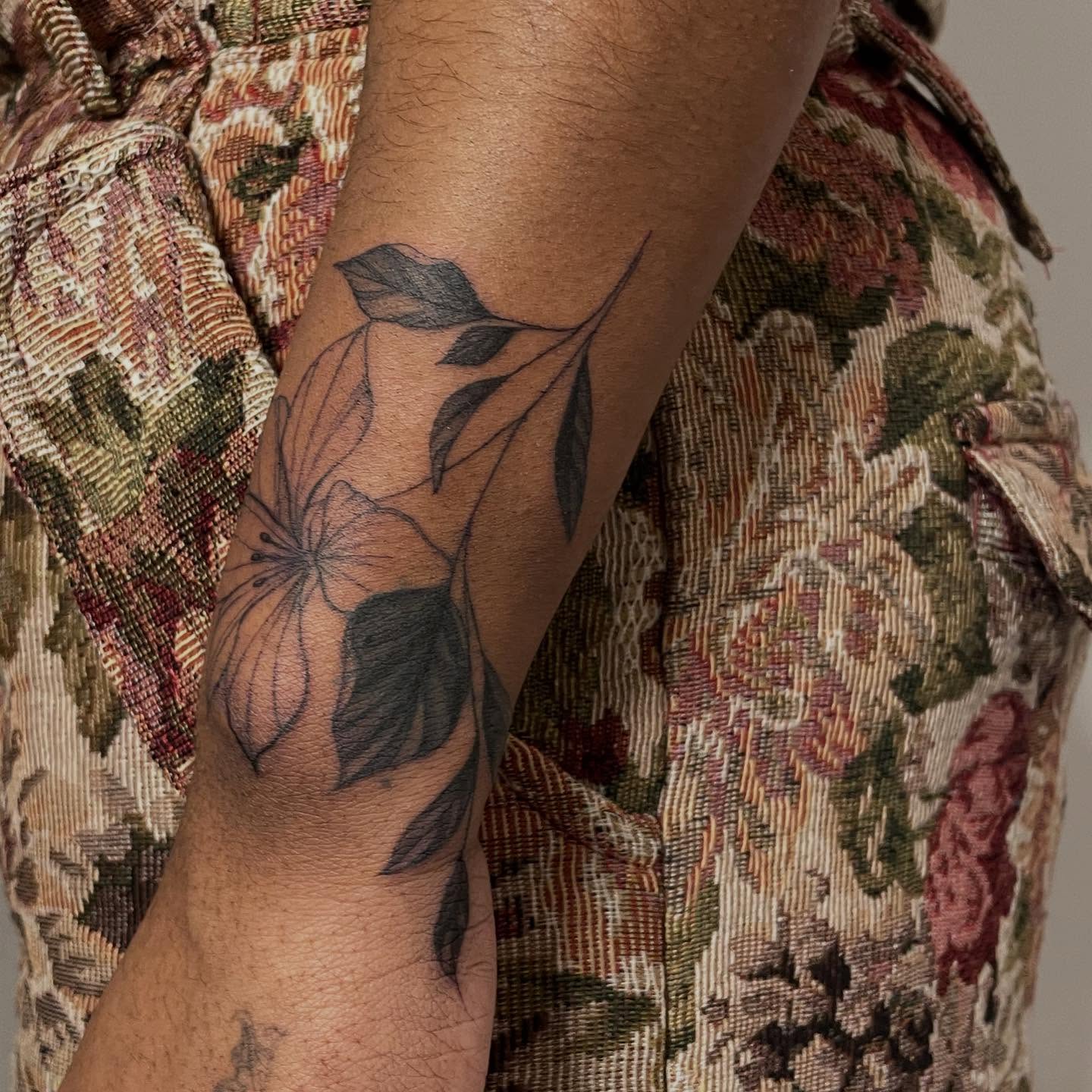 Flower and leaves black and grey tattoo on the forearm by Shamalee Delacruz✨