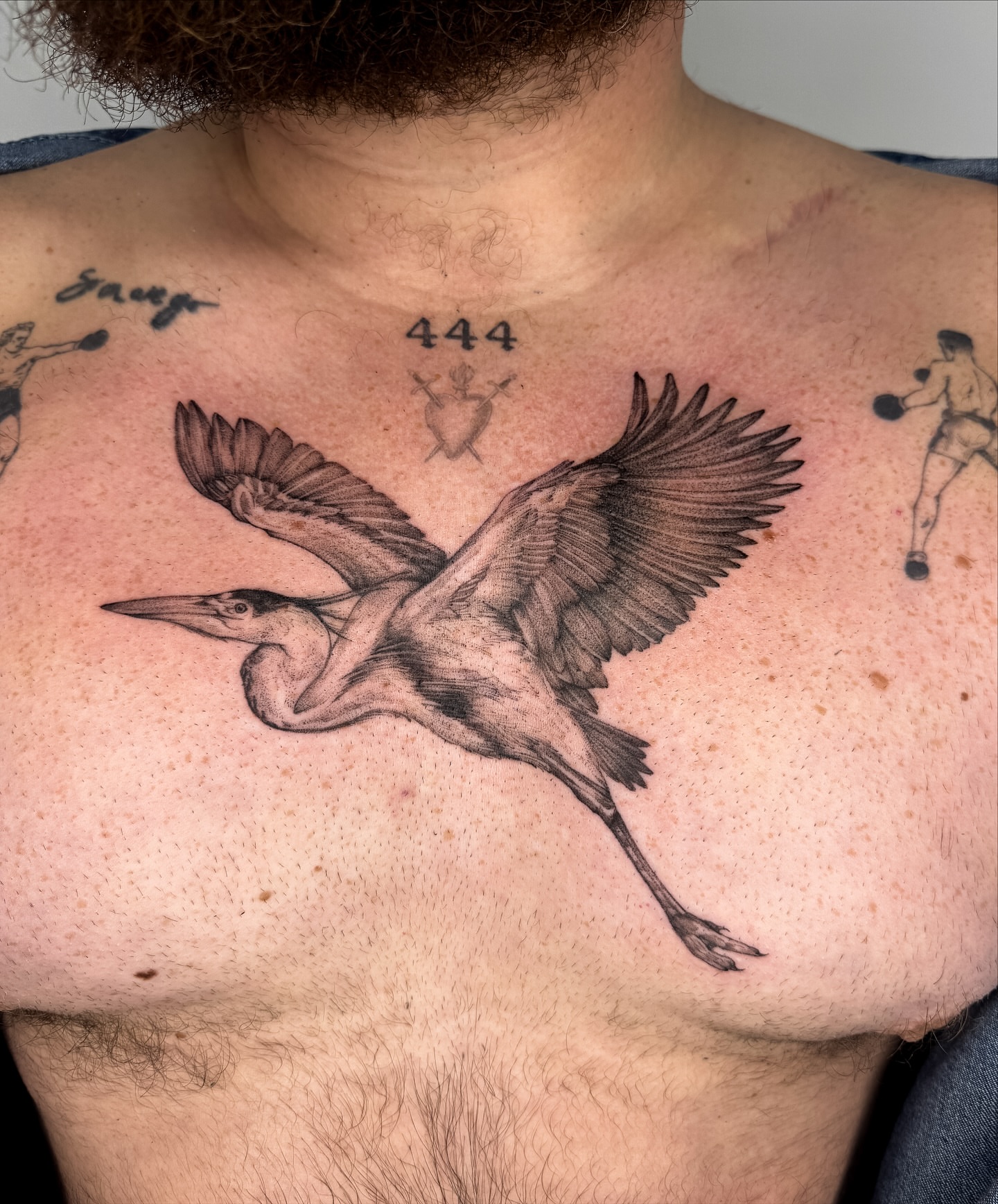 Heron realism tattoo on the chest by Emma- Los Angeles Tattoo Artist