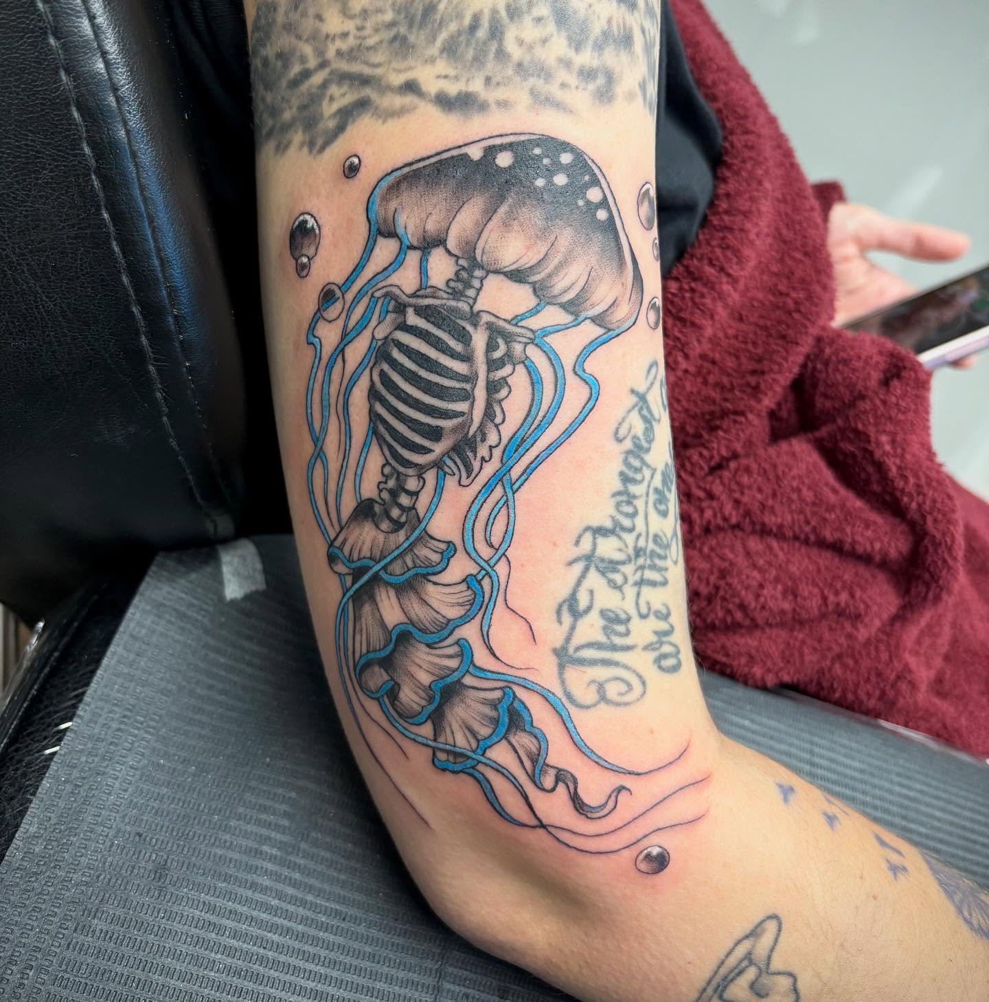 Jellyfish skeleton dotwork tattoo on the forearm by Robbie Reel, Wichita, Kansas