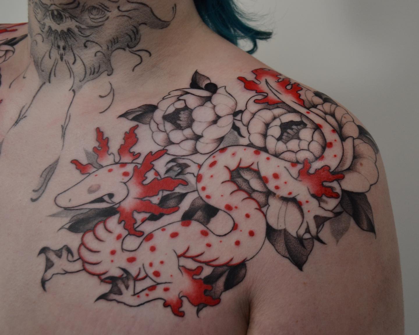 Snake and peony American traditional tattoo on the shoulder by Vanessa Acosta