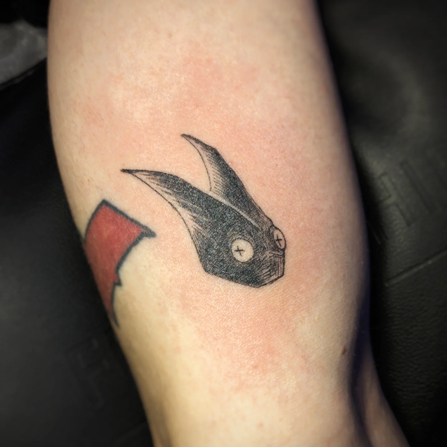 Bird black and grey tattoo on the forearm by Bek Artz