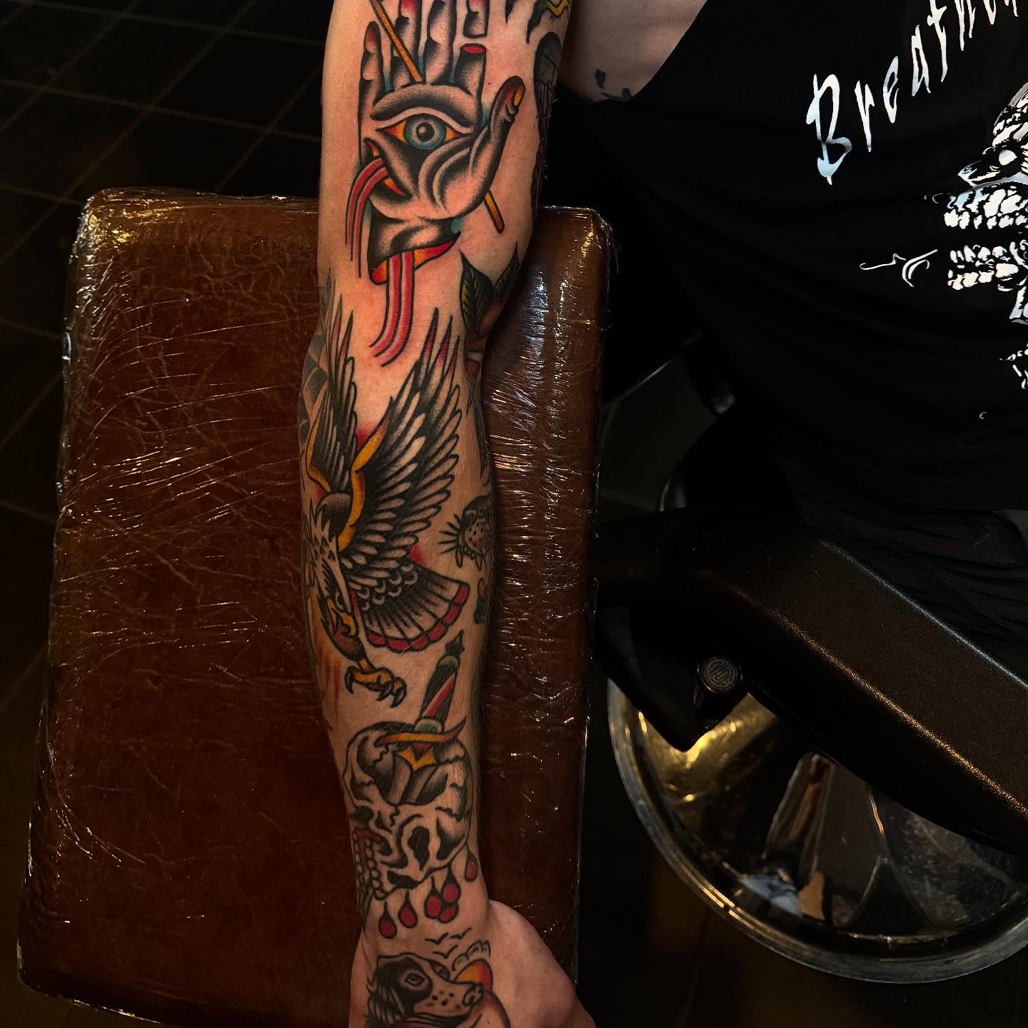 Bird and skull American traditional tattoo on the forearm by Julia Louise