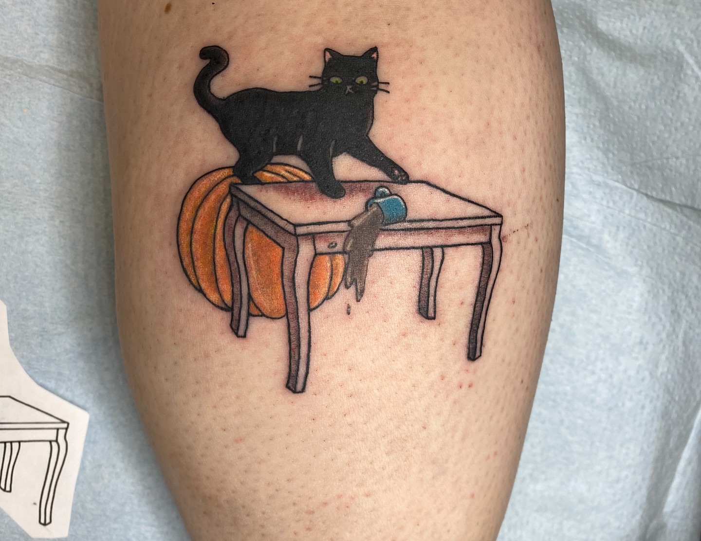 Black cat on table realism tattoo on the thigh by Destinee DeFriece