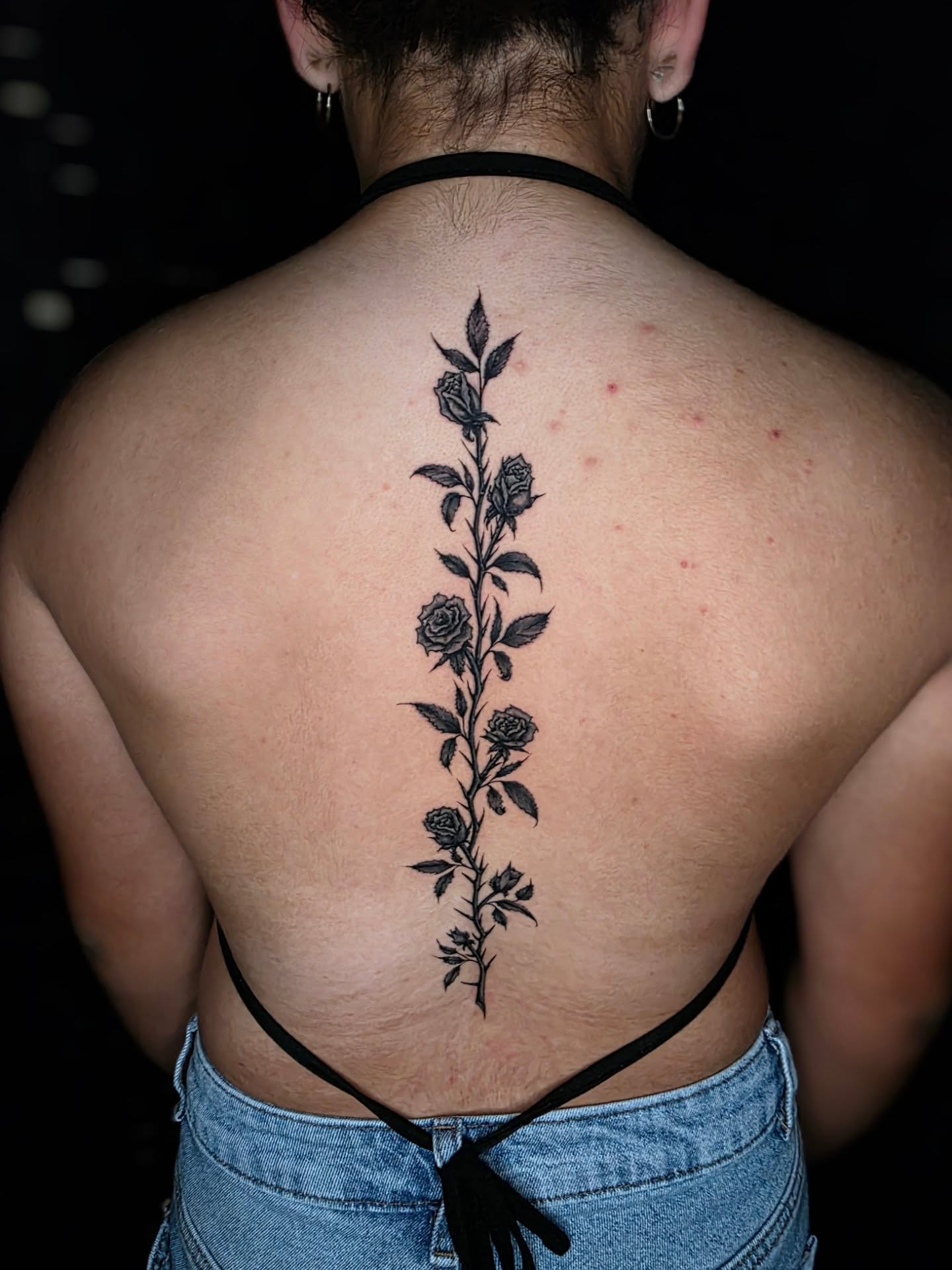 Flower vine black and grey tattoo on the back by Bry True