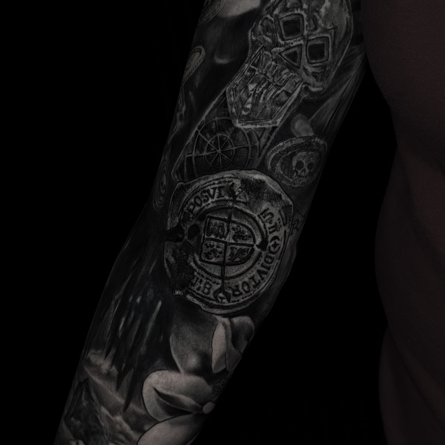 Coat of arms black and grey tattoo on the forearm by Juan Pablo Molina