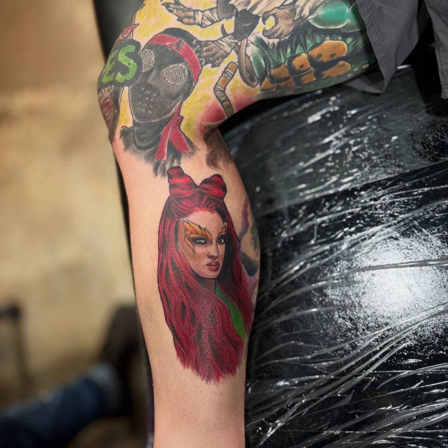 Red-haired woman realism tattoo on the thigh by David C. McGhee
