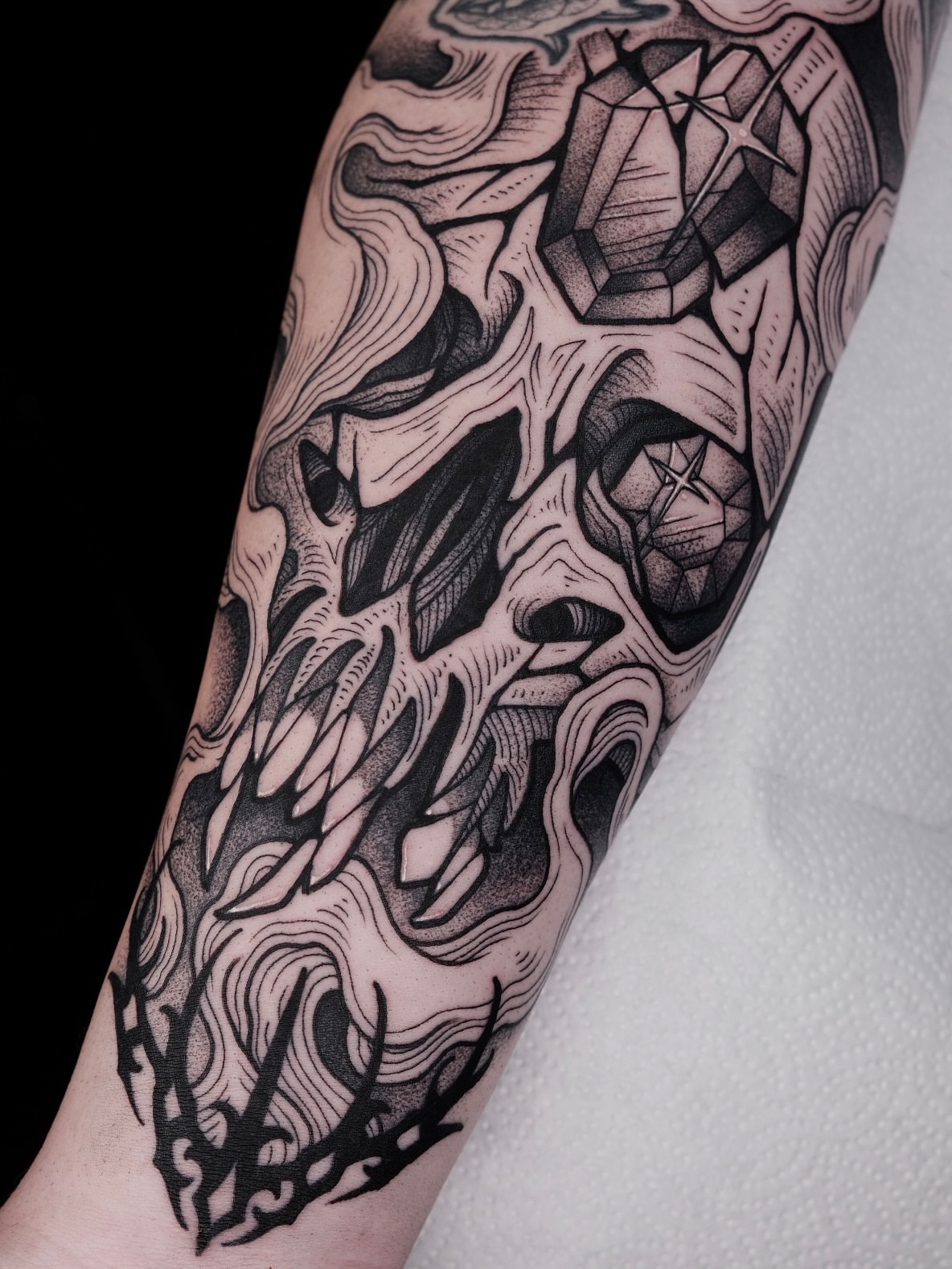 Geometric crystal geometric tattoo on the forearm by Kyle Patrick