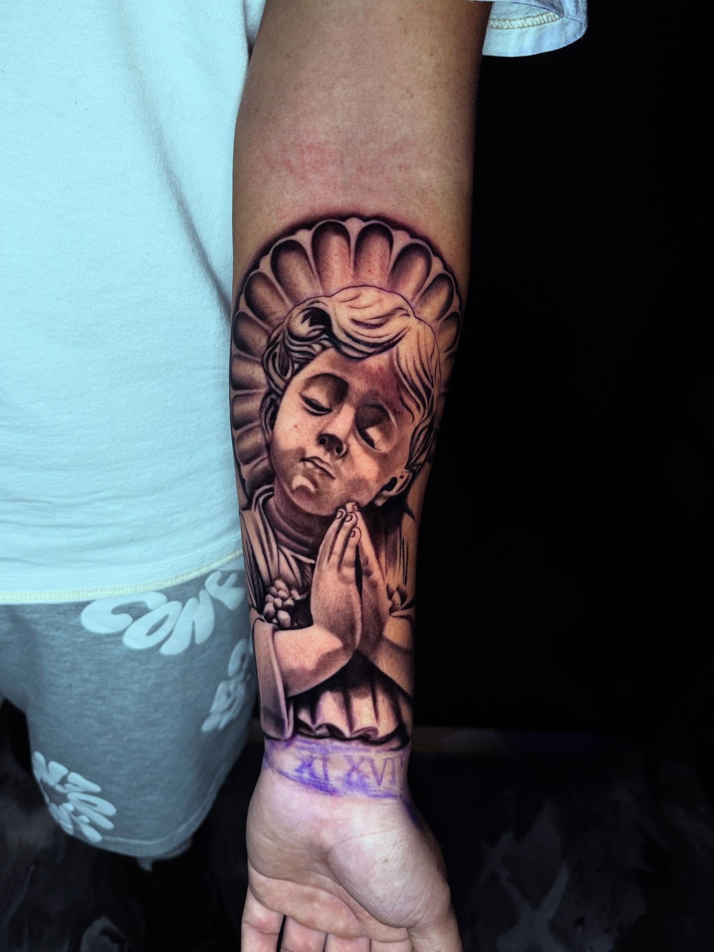 Praying child realism tattoo on the forearm by 📍 Austin