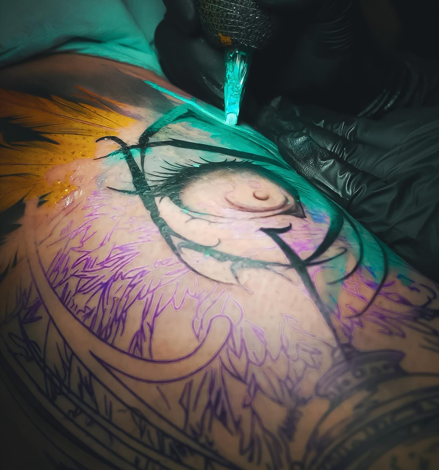 Eye anime tattoo on the upper arm by Franz Muñoz