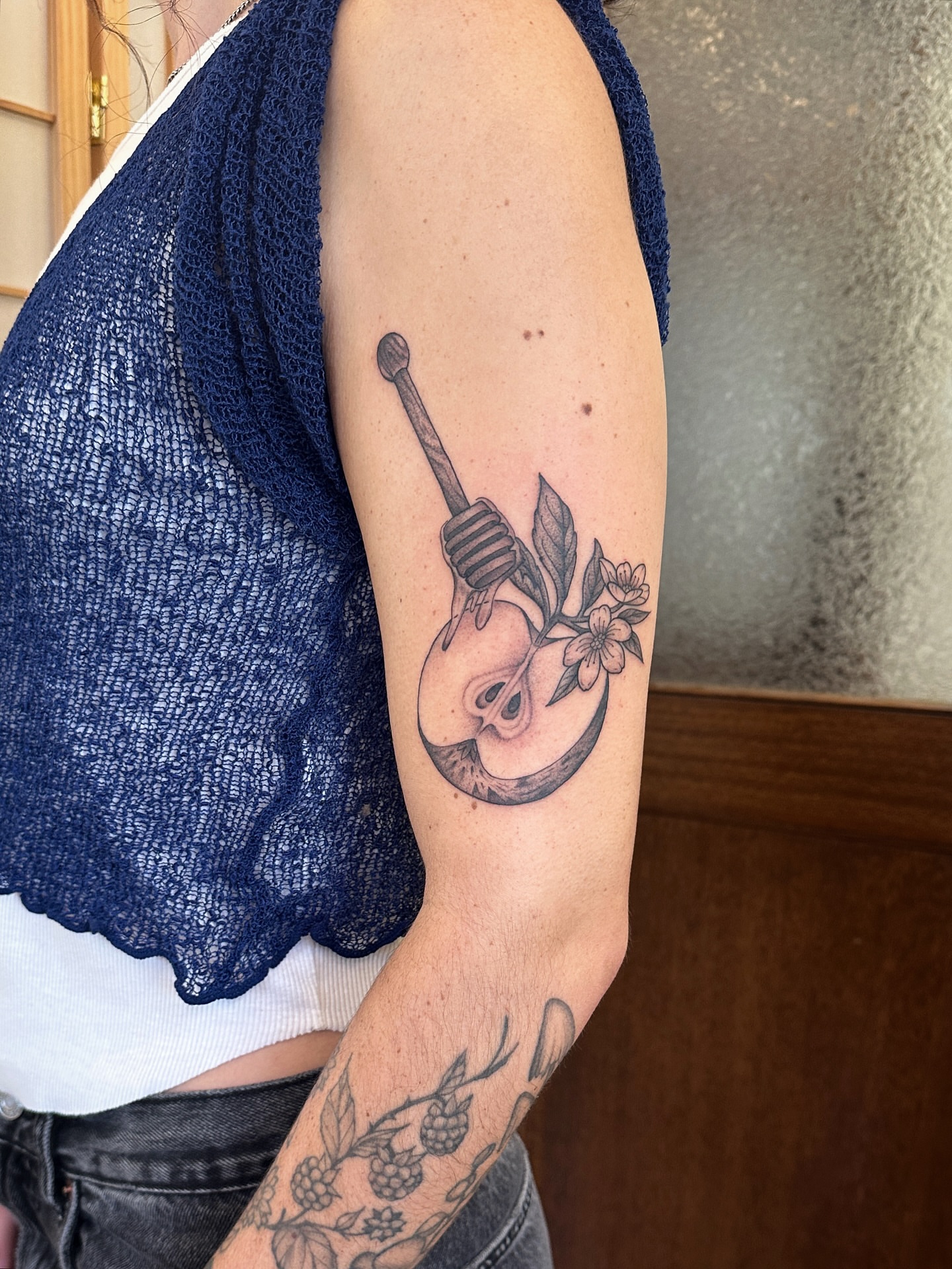 Light bulb with flowers black and grey tattoo on the forearm by Tattooing by Patty Valentine