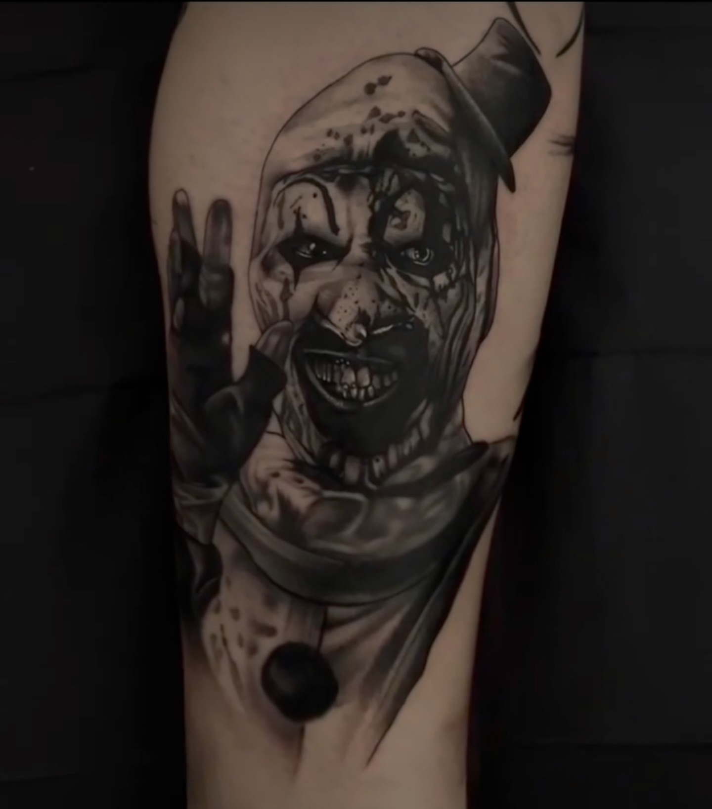 Clown realism tattoo on the forearm by Sterling Grice