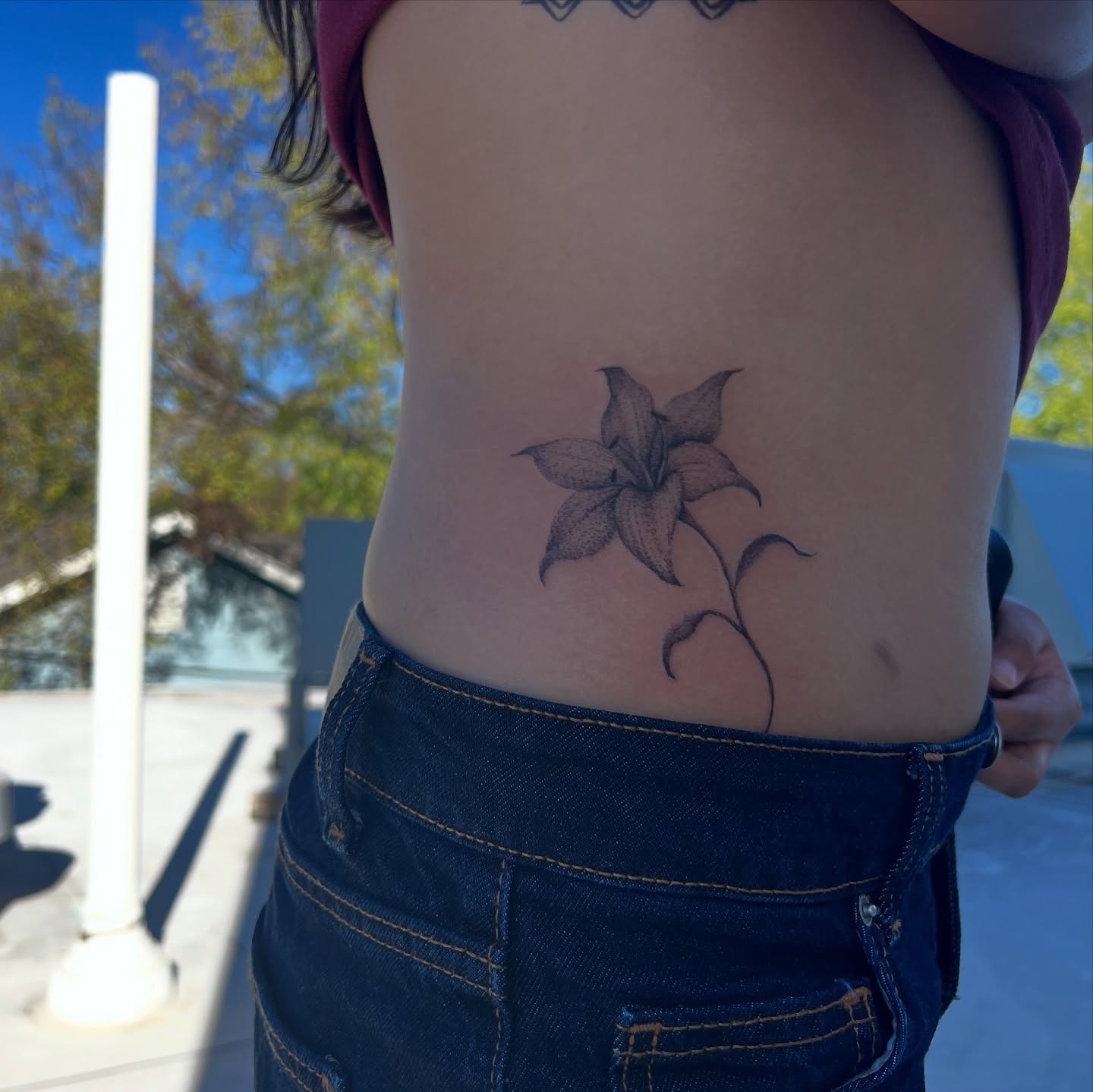 Lily dotwork tattoo on the ribs by syiko ☆ 。・:*˚:✧。, Austin, Texas