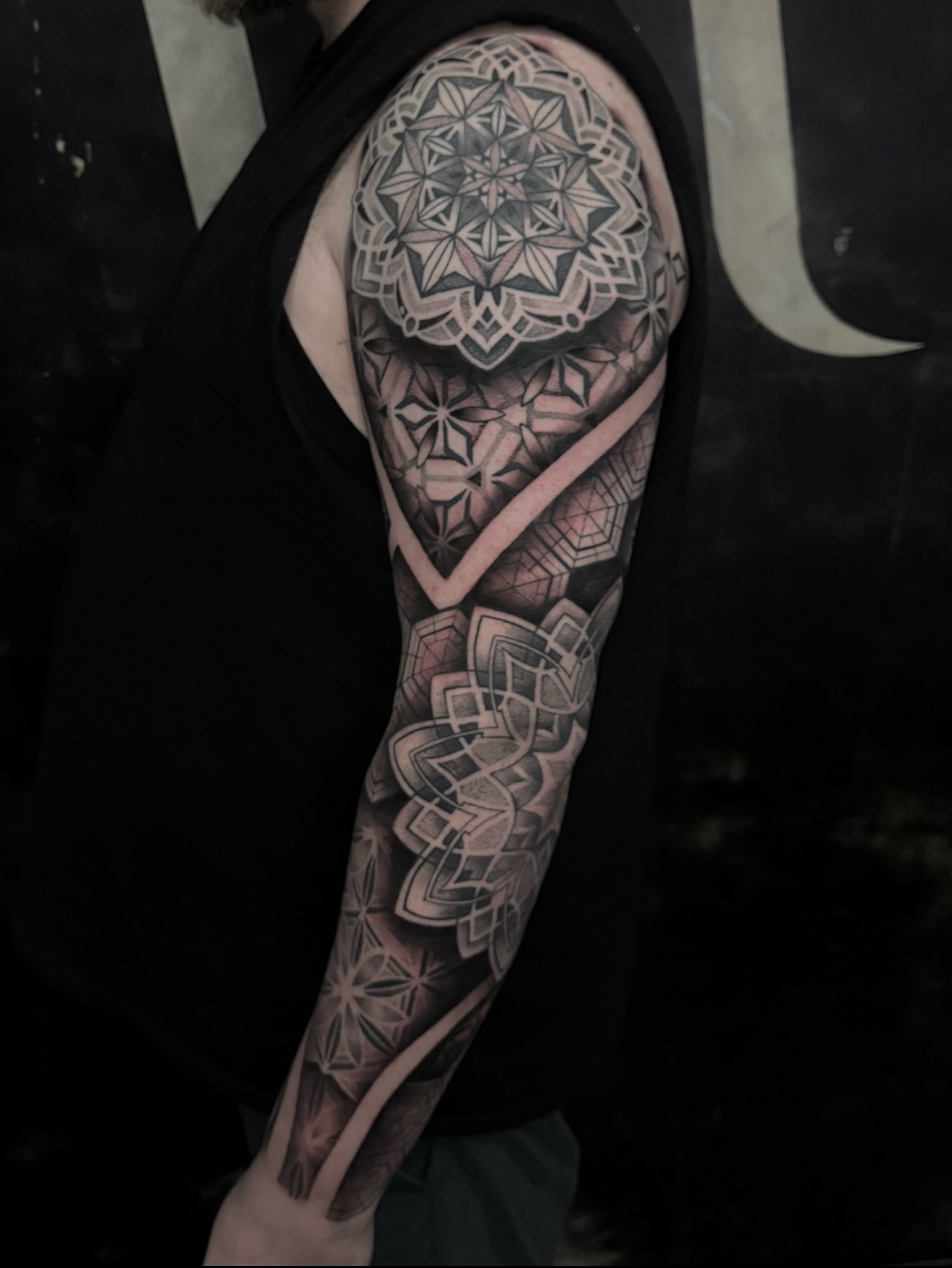 Geometric mandala geometric tattoo on the upper arm by Mel K Lockett - Nashville Tattoo Artist