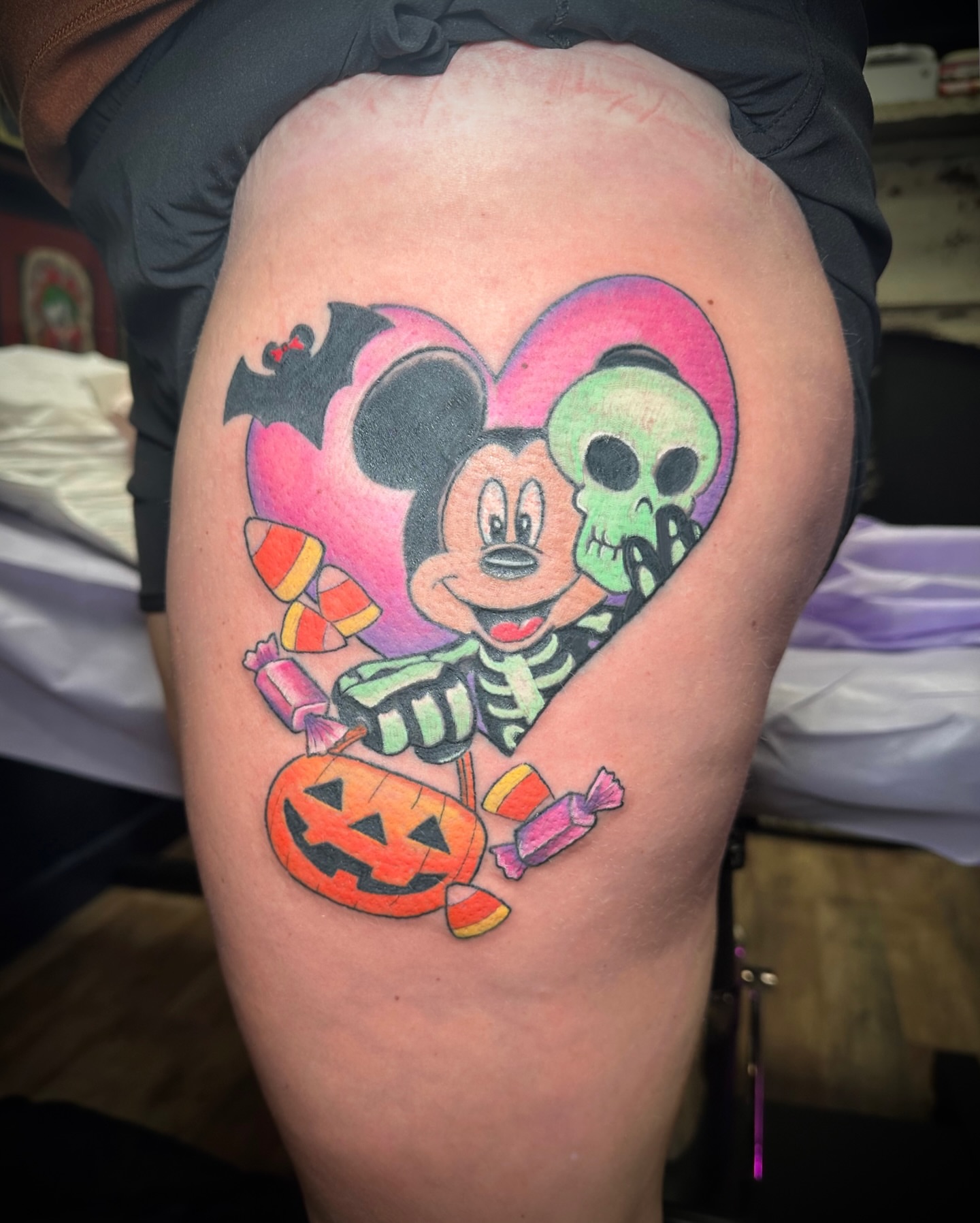 Mickey mouse halloween new school tattoo on the thigh by Chris Gray