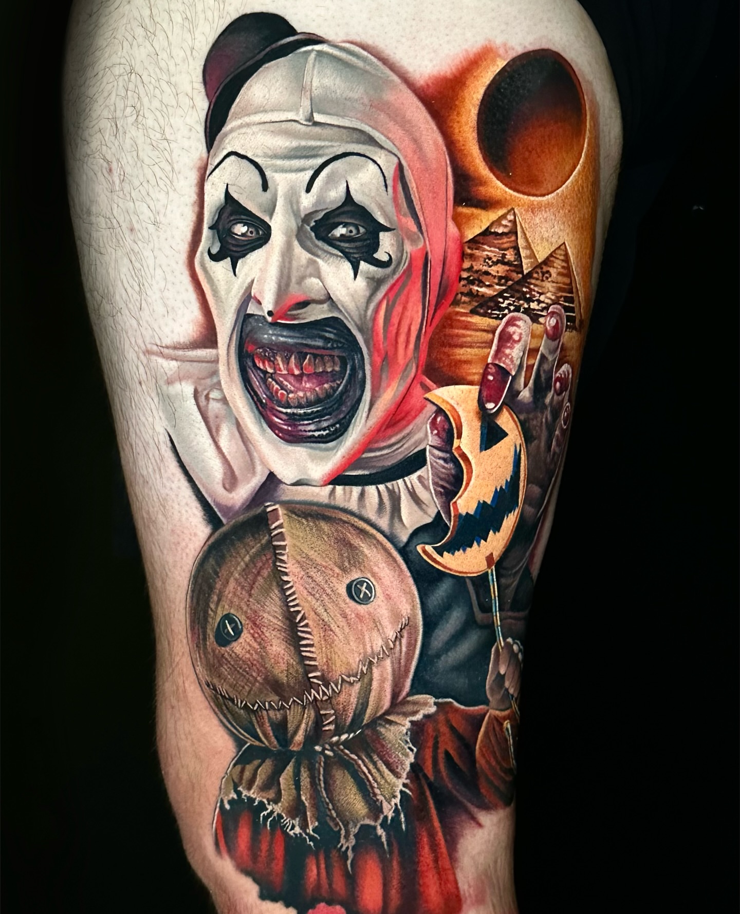 Clown and pumpkin realism tattoo on the forearm by Chynna J El-Ayazra