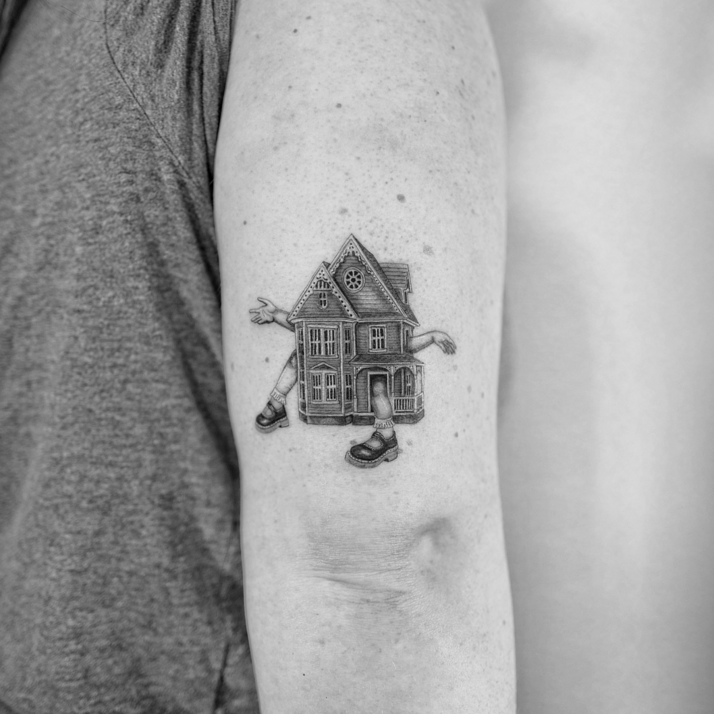 House with arms realism tattoo on the forearm by Ross Clark Tattoos
