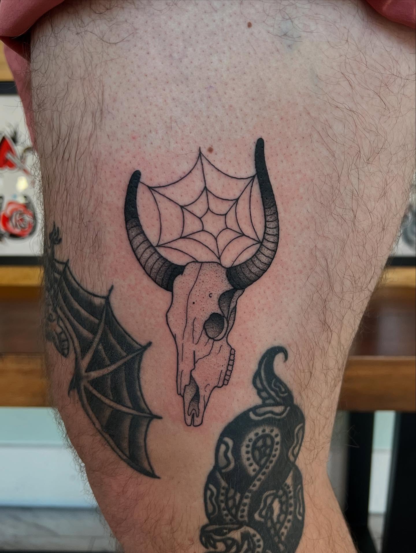 Bull skull with spiderweb neo-traditional tattoo on the thigh by 𝖆𝖑𝖞𝖘𝖘𝖆 ☽