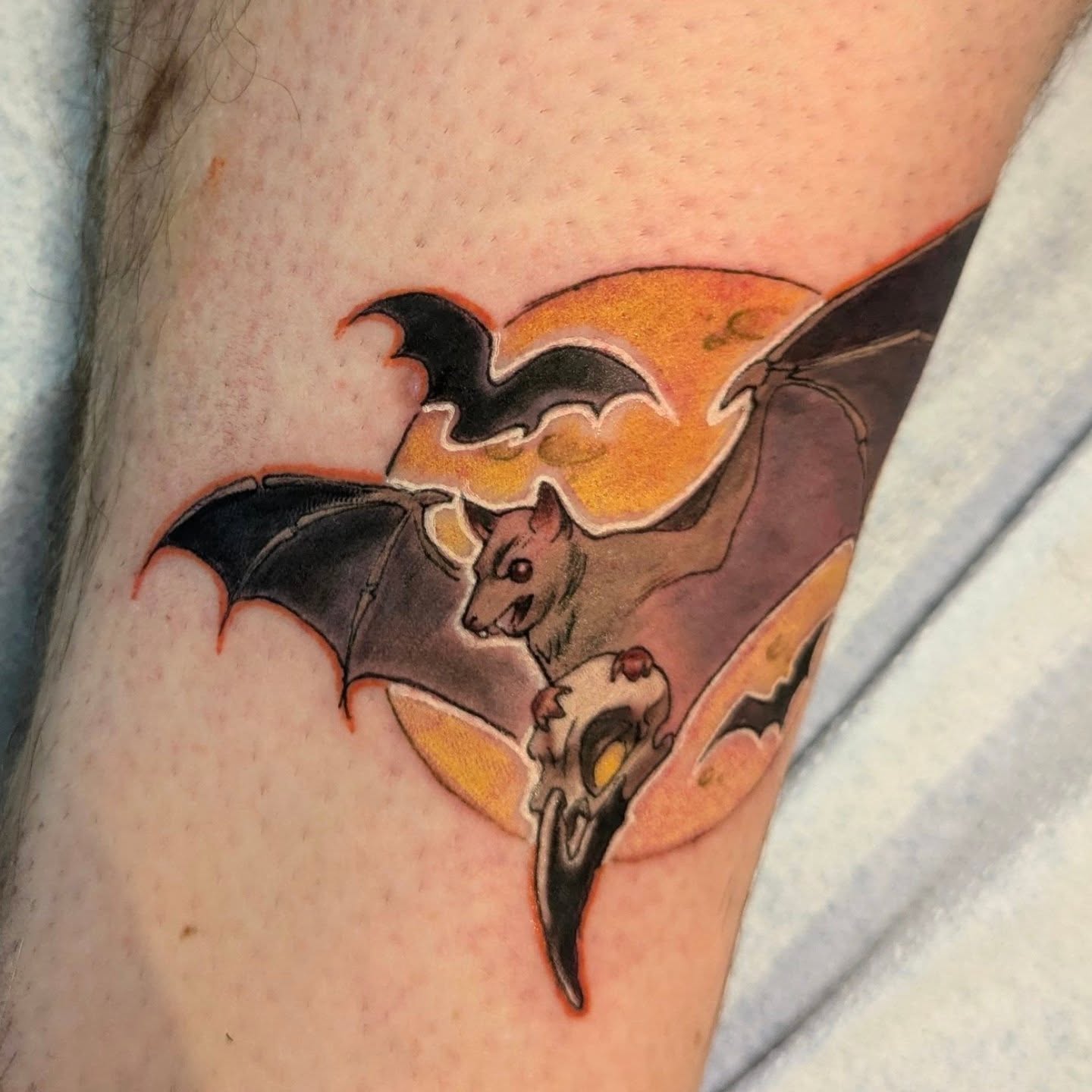 Bat and skull American traditional tattoo on the forearm by Lahel (Lay-el) Fowler
