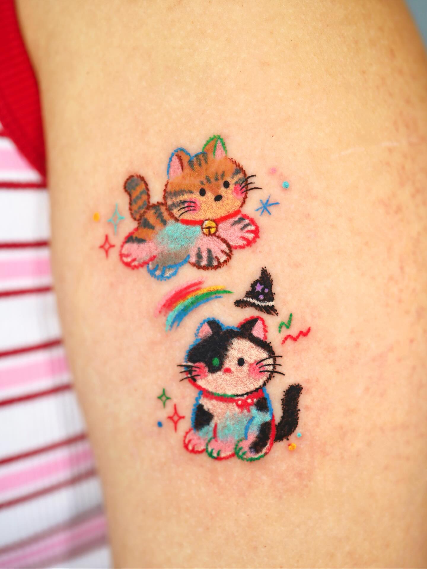 Cat and rainbow illustrative tattoo on the thigh by Kettle🤍케틀