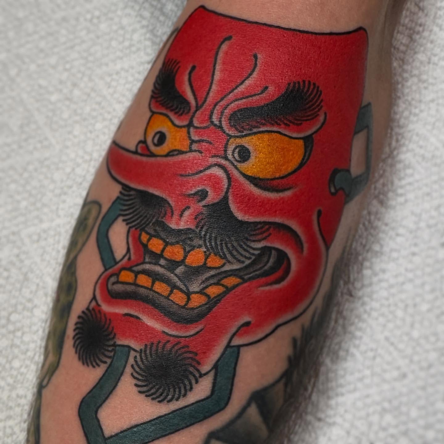 Demon mask American traditional tattoo on the forearm by Cole Pittman Memphis Tattoo artist, Memphis, Tennessee