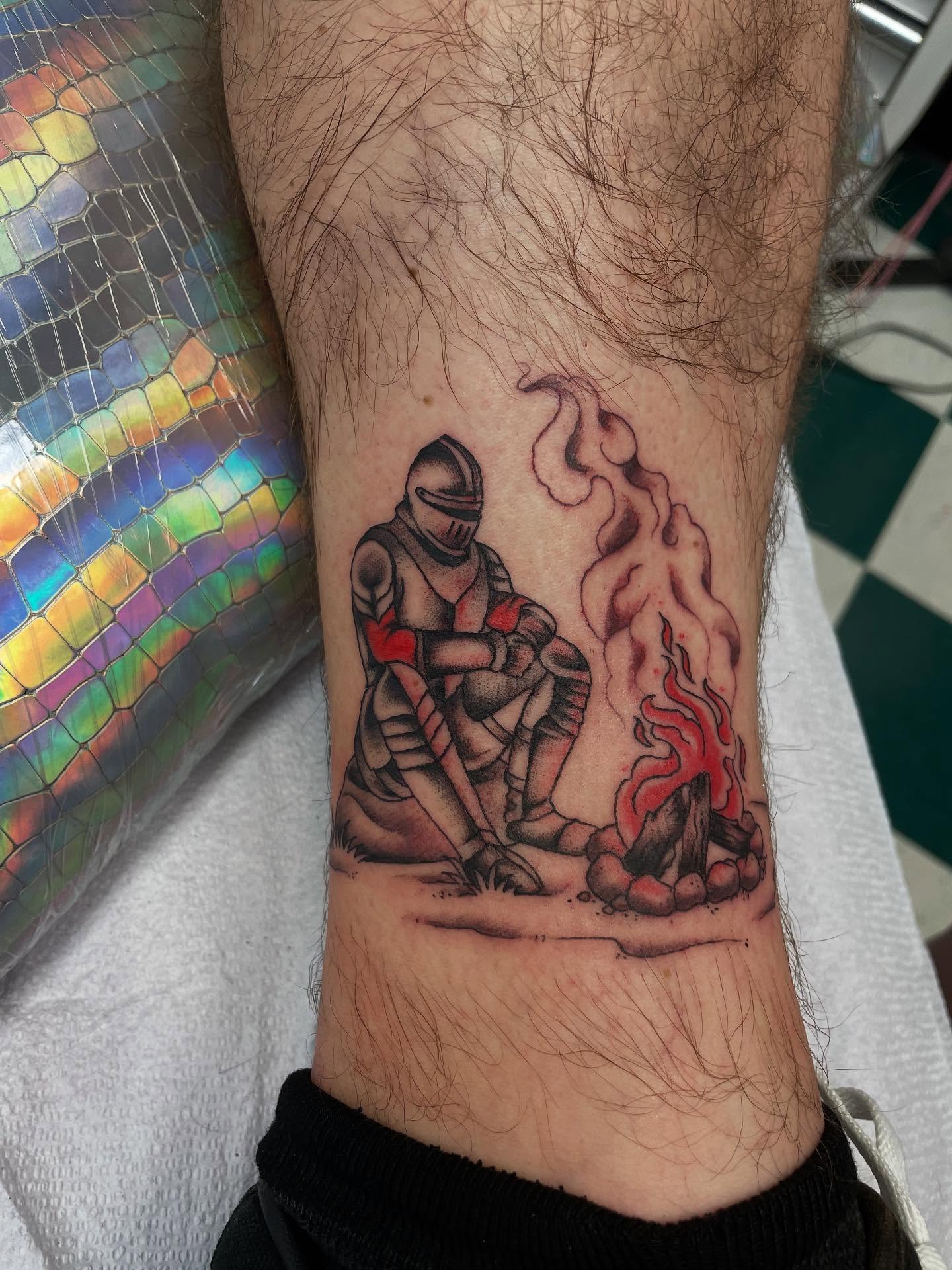 Knight by campfire black and grey tattoo on the forearm by Dayton Tattoo Artist, Miamisburg, Ohio