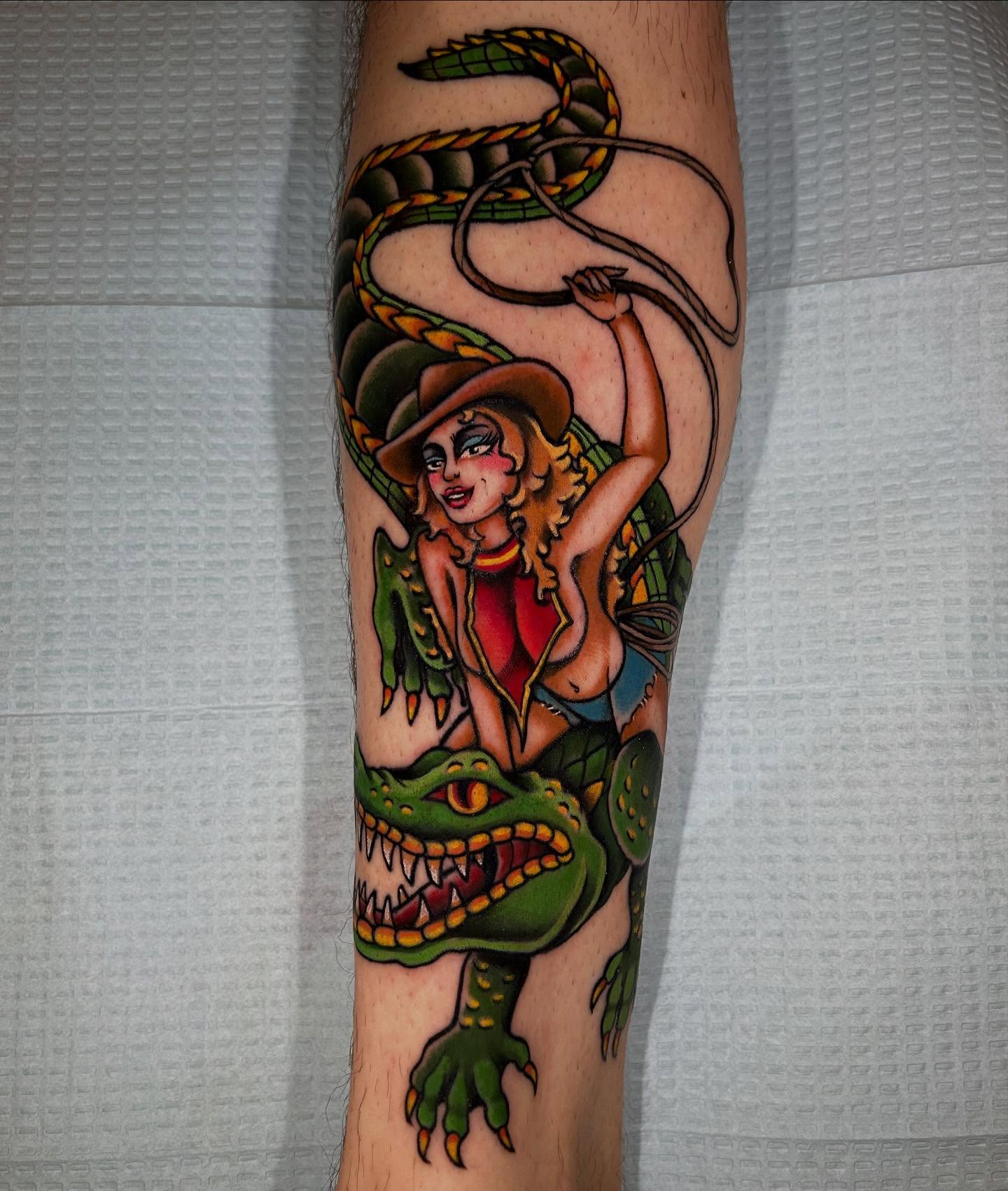 Cowgirl and alligator American traditional tattoo on the forearm by Lexi Kniskern