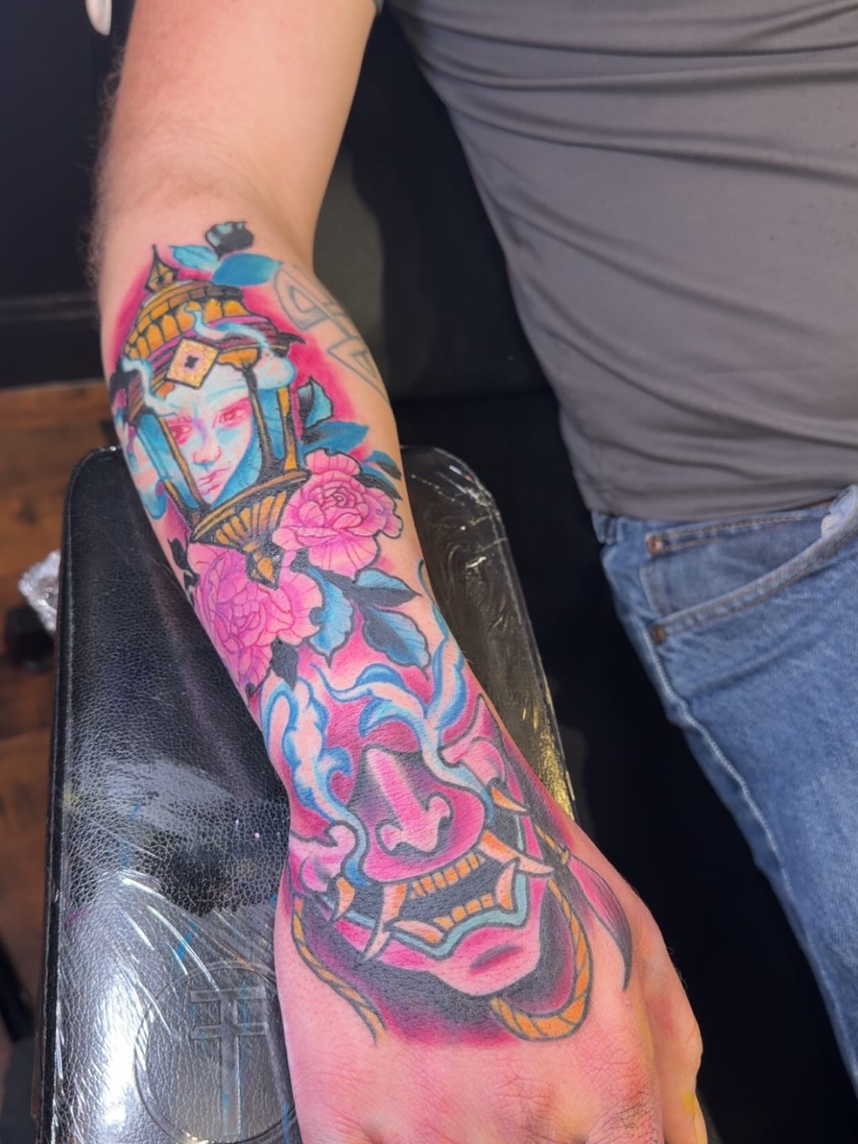 Geisha and floral new school tattoo on the forearm by Robbie Roberson
