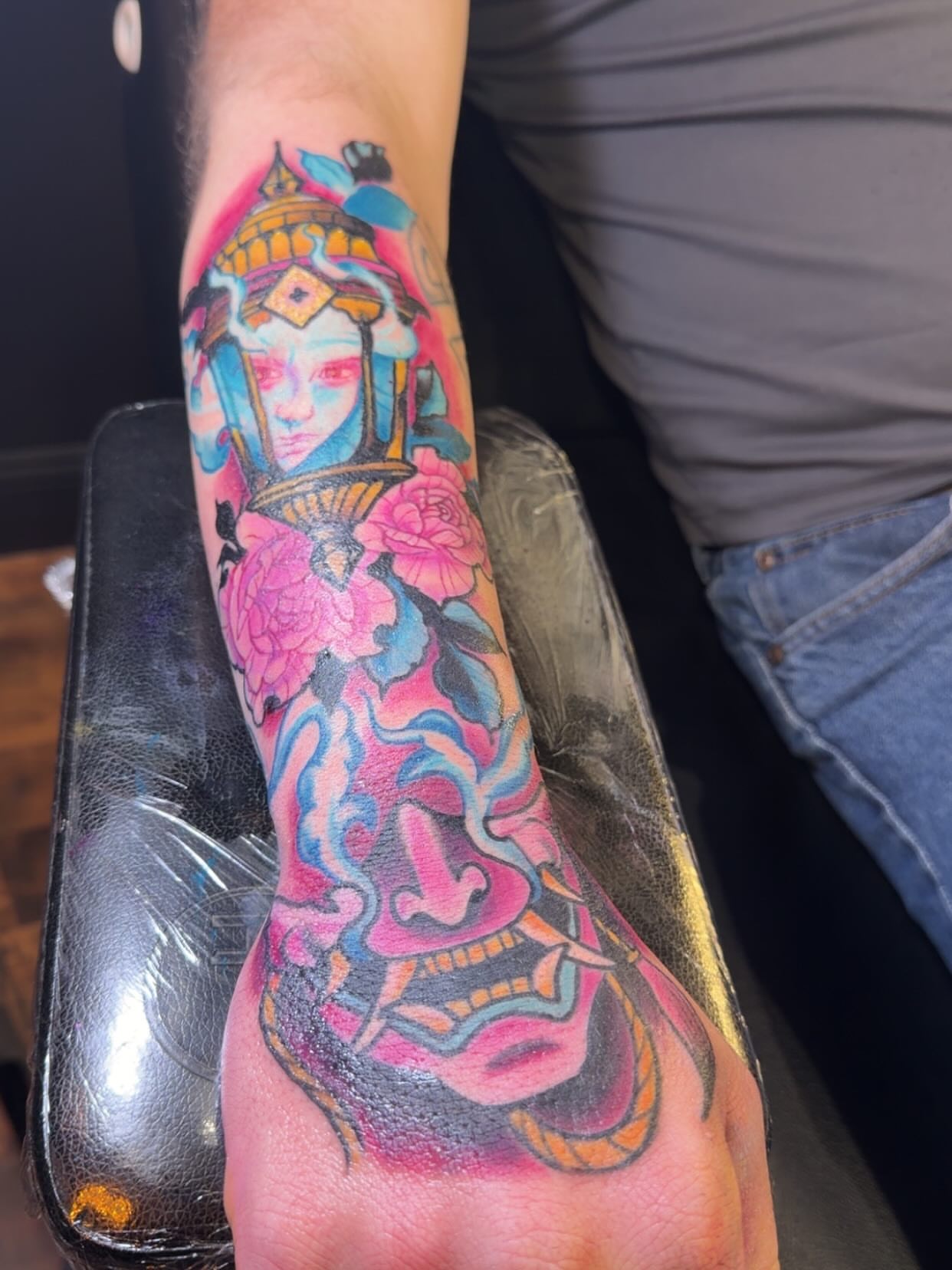 Geisha and flowers new school tattoo on the forearm by Robbie Roberson