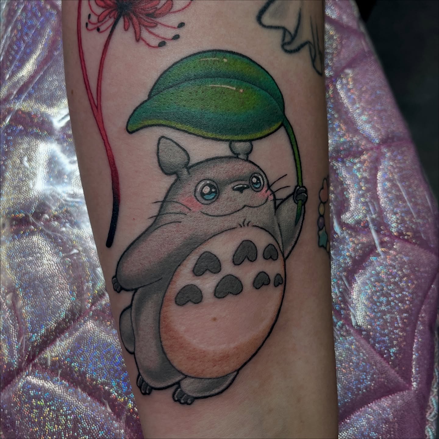 Totoro anime tattoo on the forearm by Cheyanne Peck