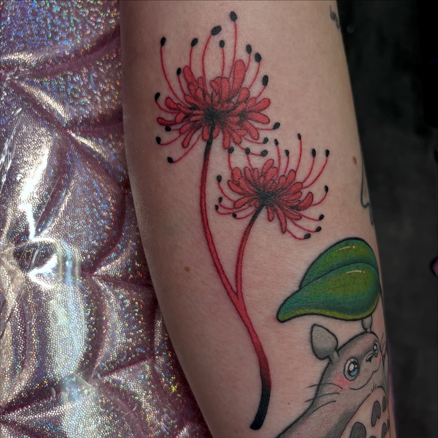 Red spider lilies dotwork tattoo on the forearm by Cheyanne Peck