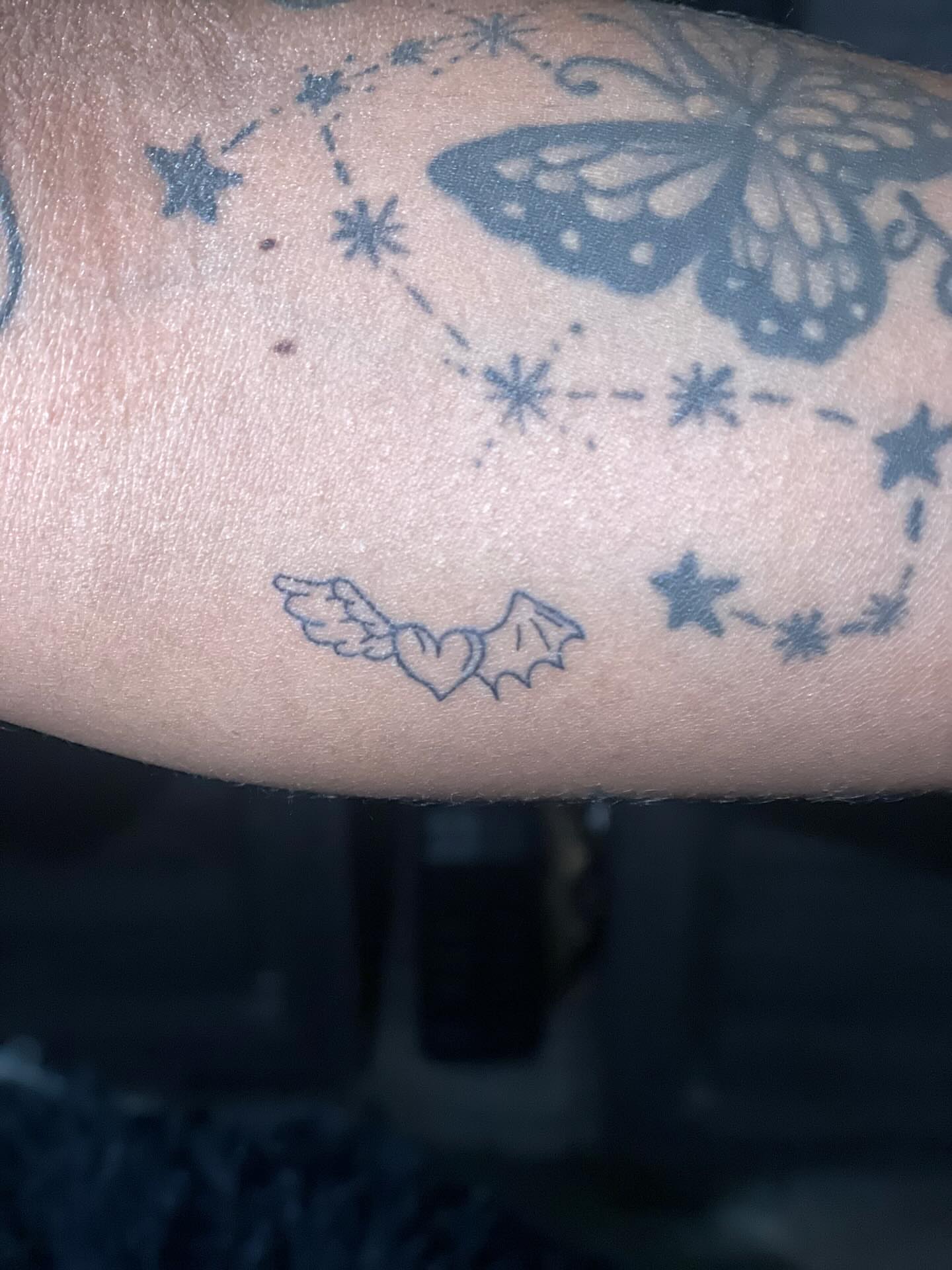 Butterfly and stars black and grey tattoo on the forearm by 😈headhuncho😈