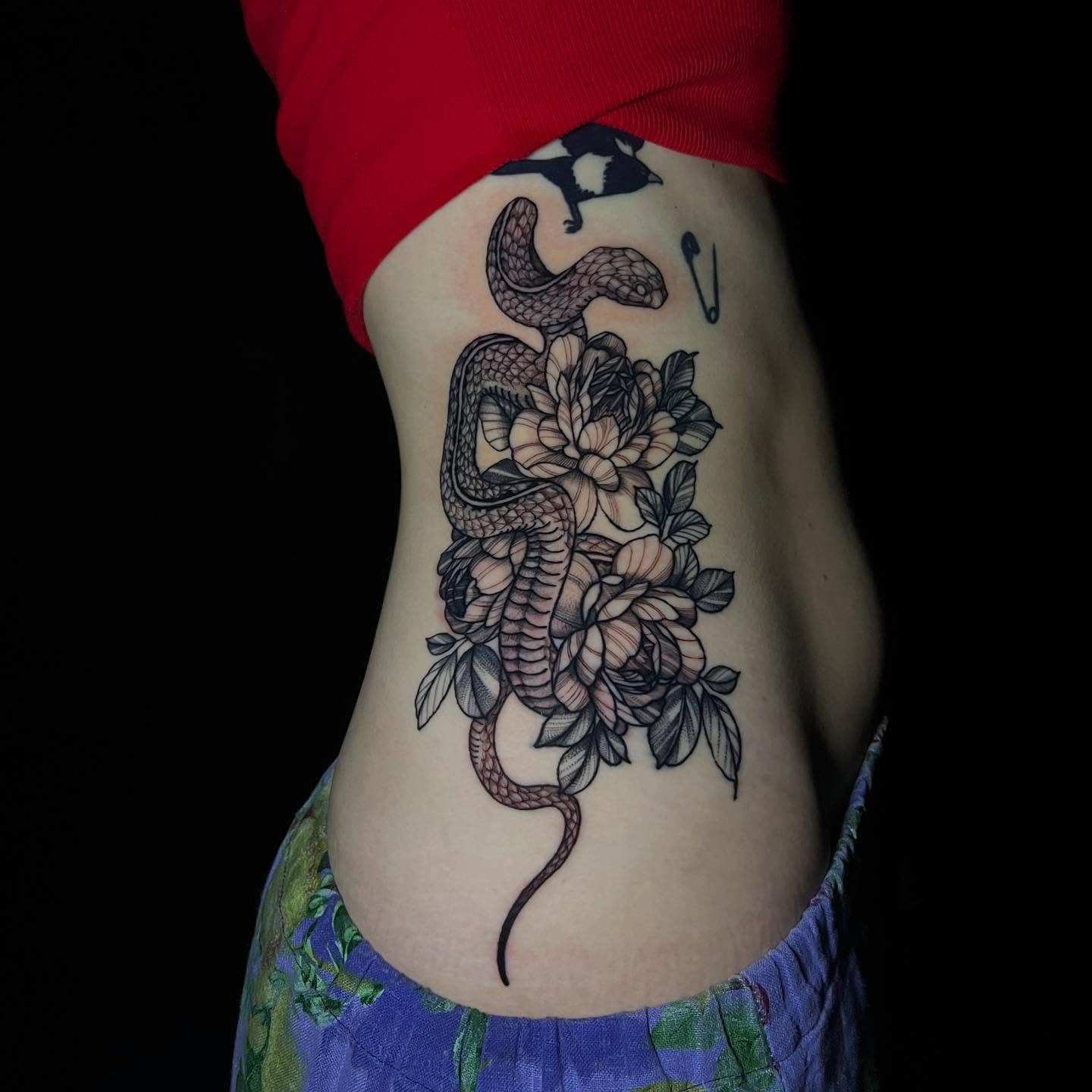 Snake and peony realism tattoo on the ribs by Brooke, Kansas City, Missouri