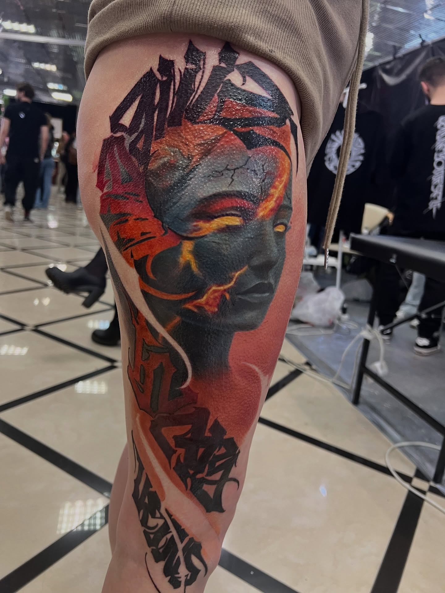 Abstract face realism tattoo on the thigh by Sacramento tattoo