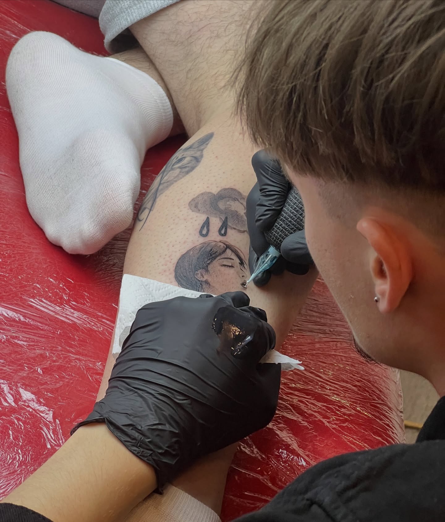 Woman's face with tears dotwork tattoo on the thigh by Sacramento tattoo