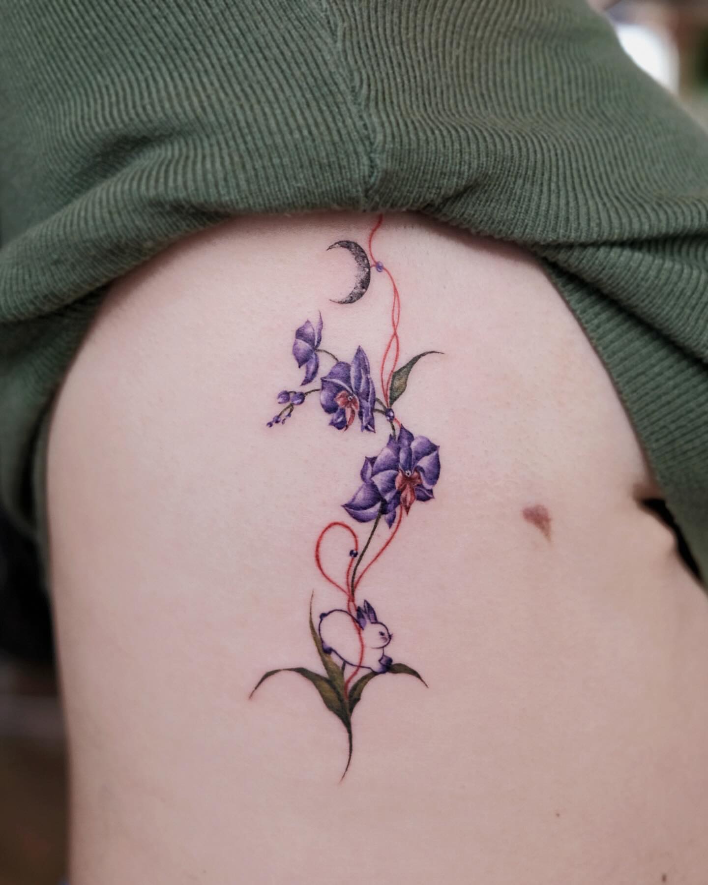 Purple flowers and moon new school tattoo on the thigh by 애박 ⋆⁺₊ ₊⁺⋆ Aebak